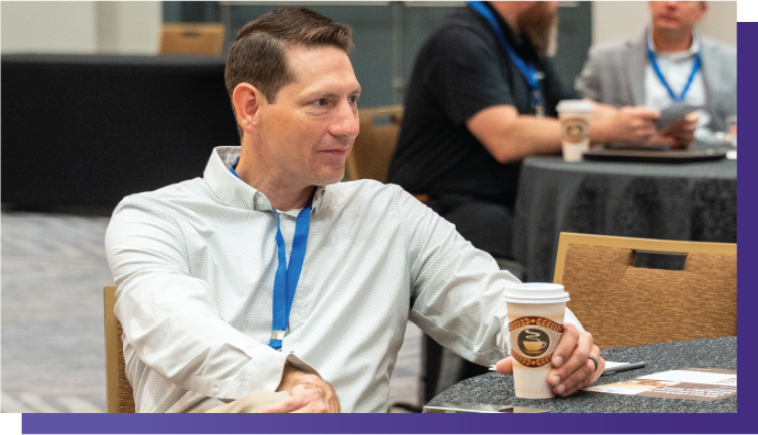 Professional networking at AI in Oil and Gas Conference, artificial intelligence in oil and gas industry event, Delegate enjoying coffee during AI in Oil and Gas networking session